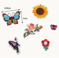 Strijkemblemen bloemen vlinders 30 stuks